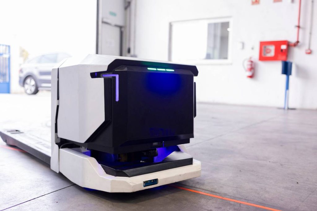 AGV RFID integration showing autonomous mobile robots with built-in RFID readers in Indian warehouse