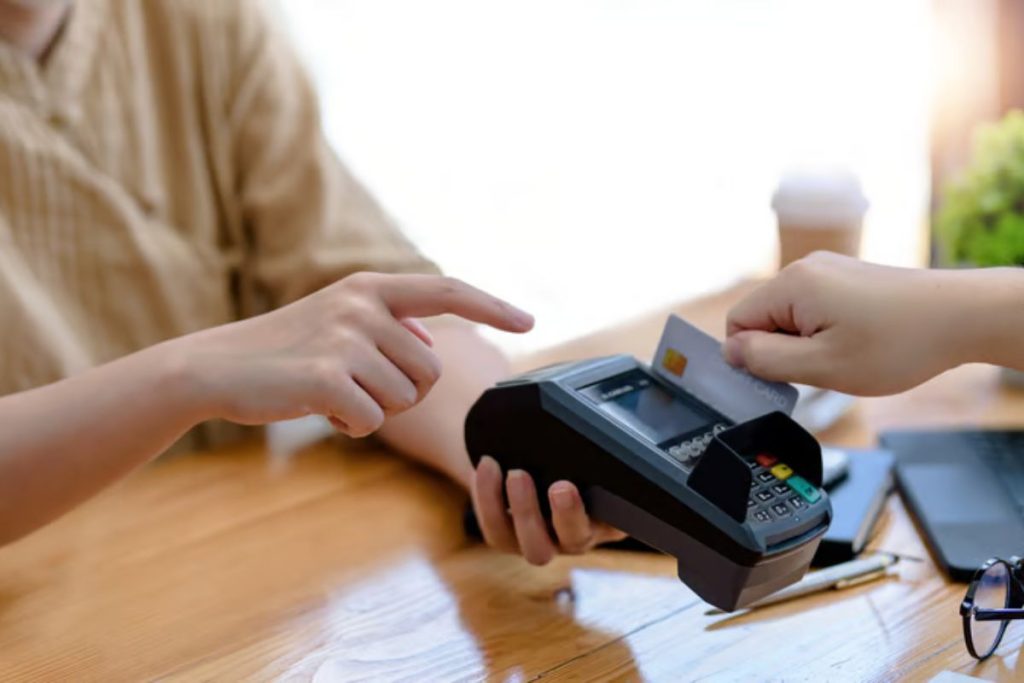Industrial asset management system in India showing a user inserting an authorization smart card into a secure reader terminal to track asset handling permissions