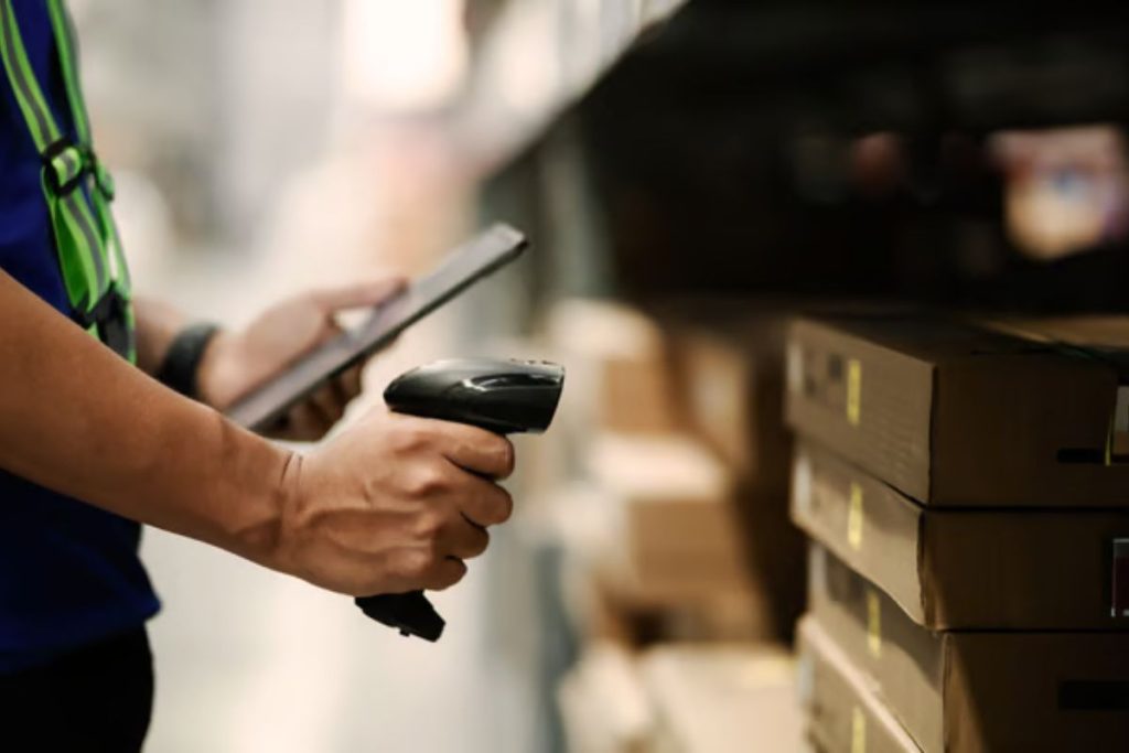 Inventory reconciliation RFID system processing real-time item scans at warehouse entry gates to eliminate manual stock tracking discrepancies